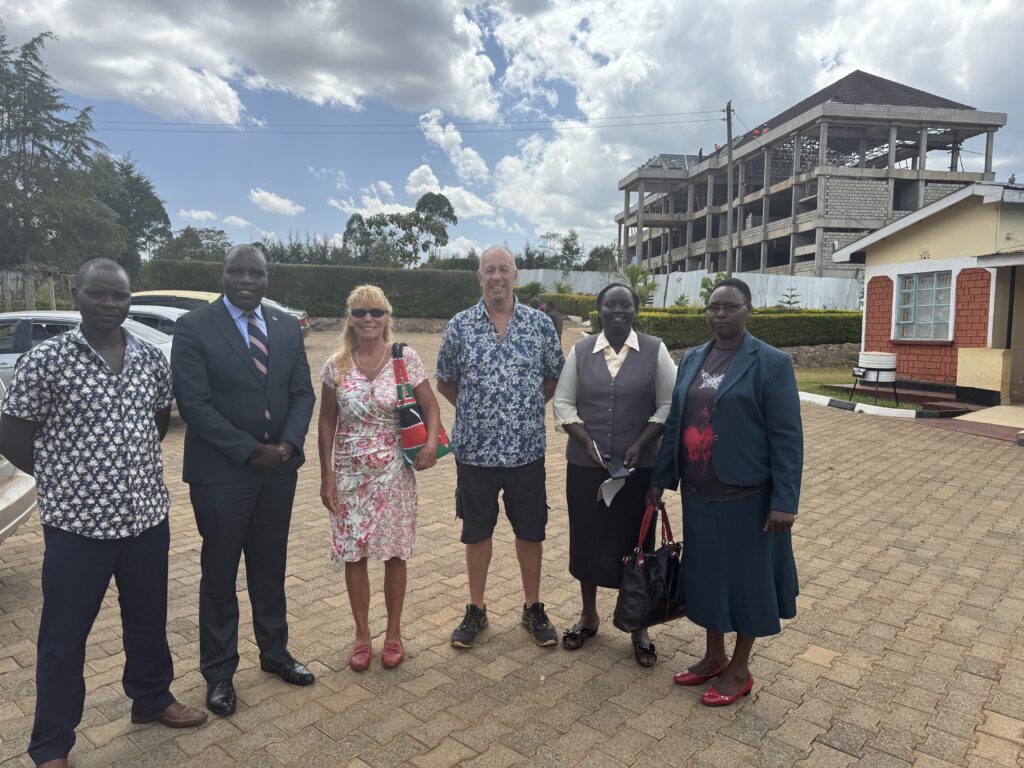 Group photo of Nandi School project officials and members of the SDA church